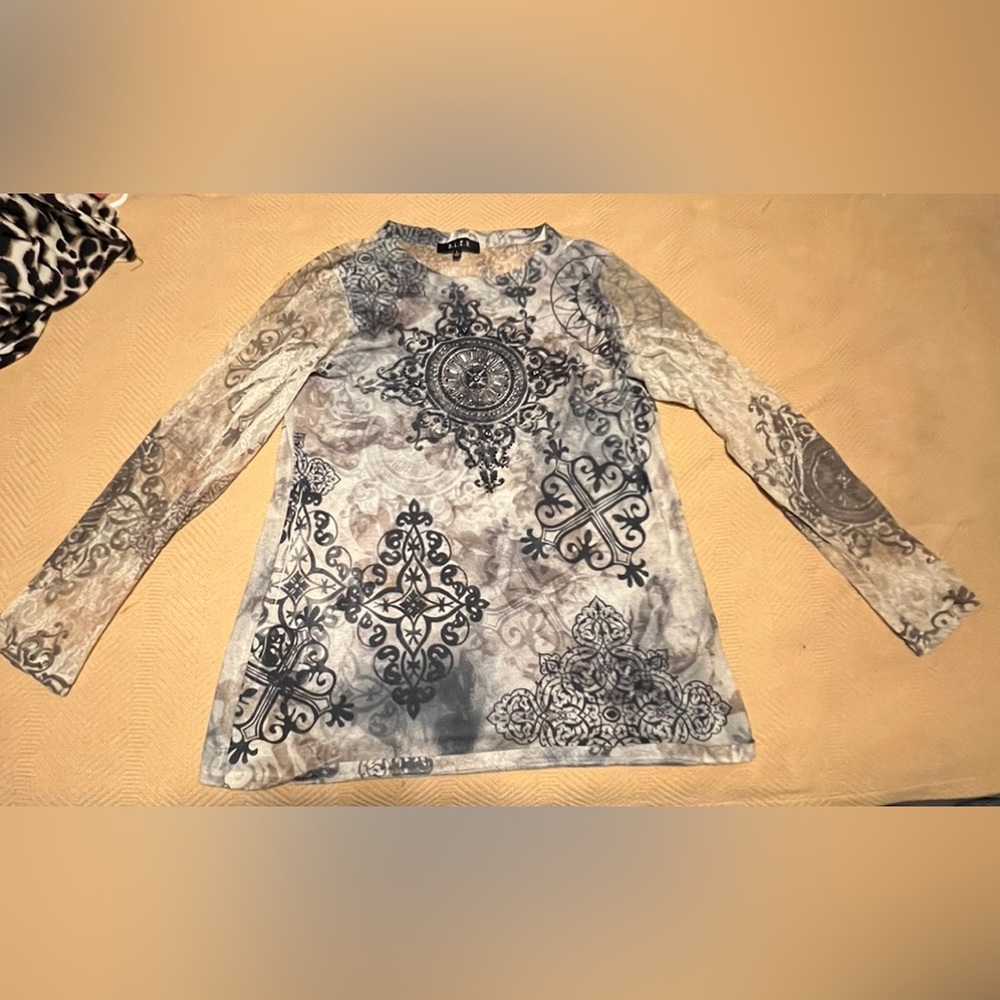 B.L.E.U. Shirt in a Large. It’s Olive, black and cream colored. Wore 3 x’s.